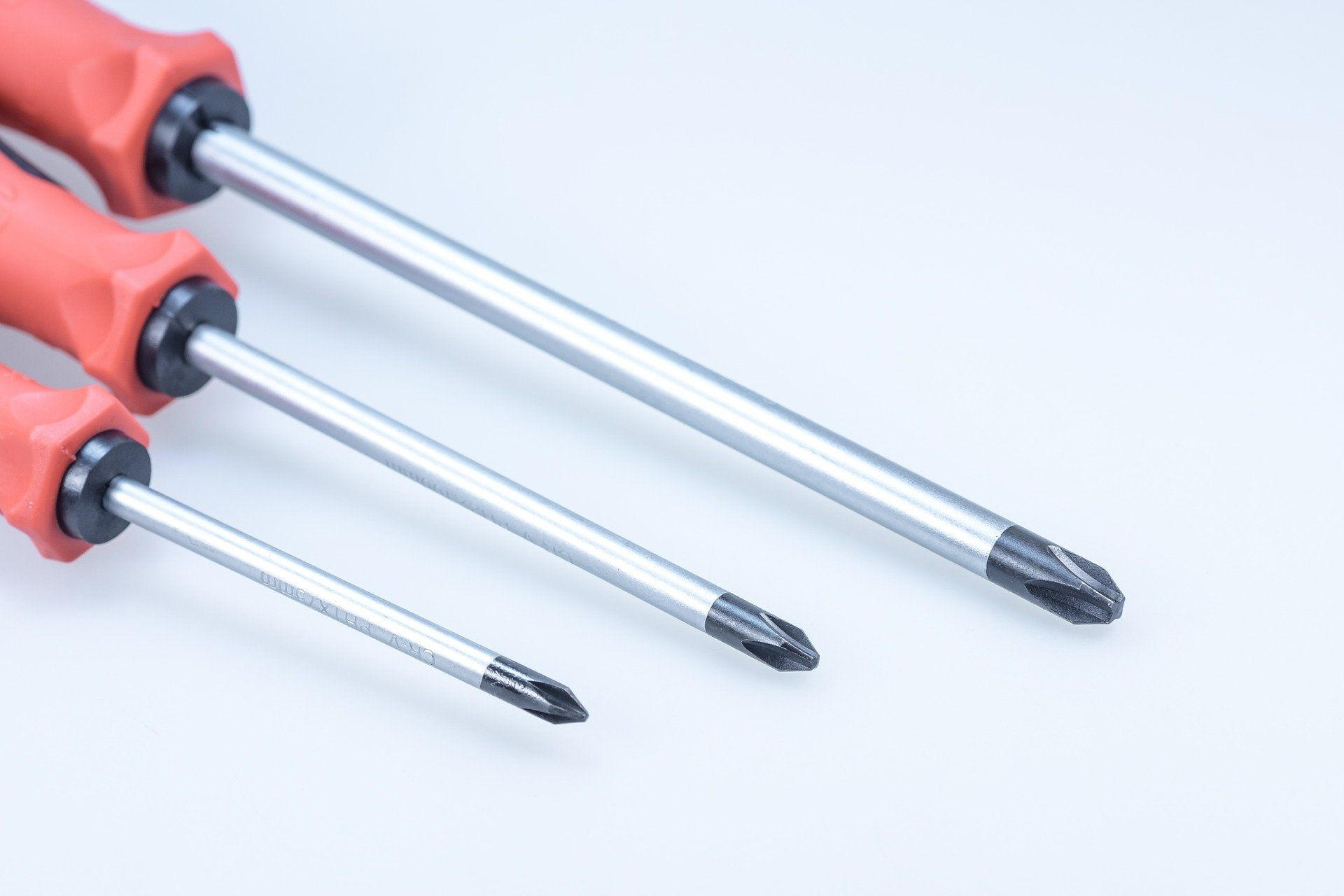 three different sized screw drivers