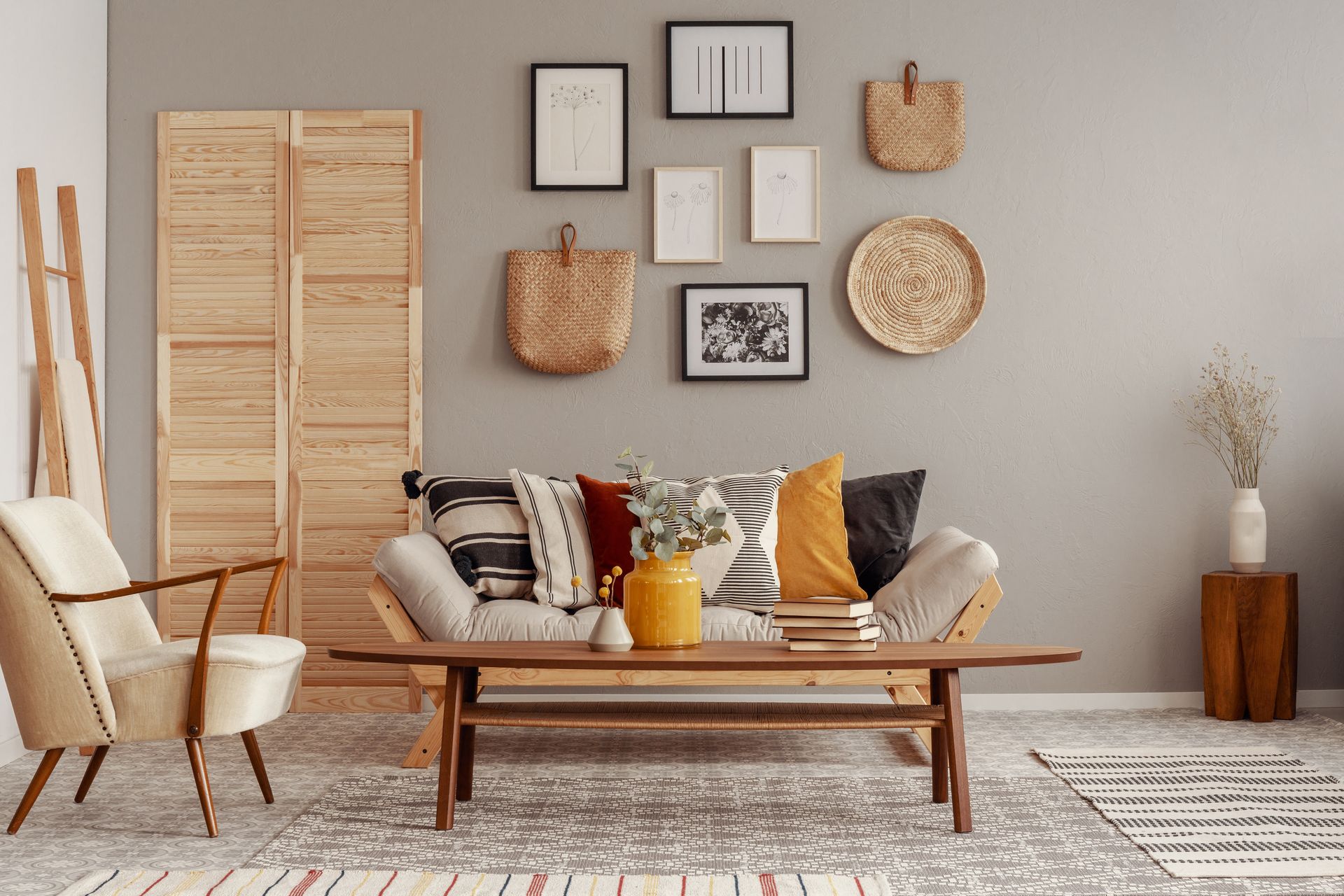 Scandinavian style living space with trendy creme colors and a gallery wall