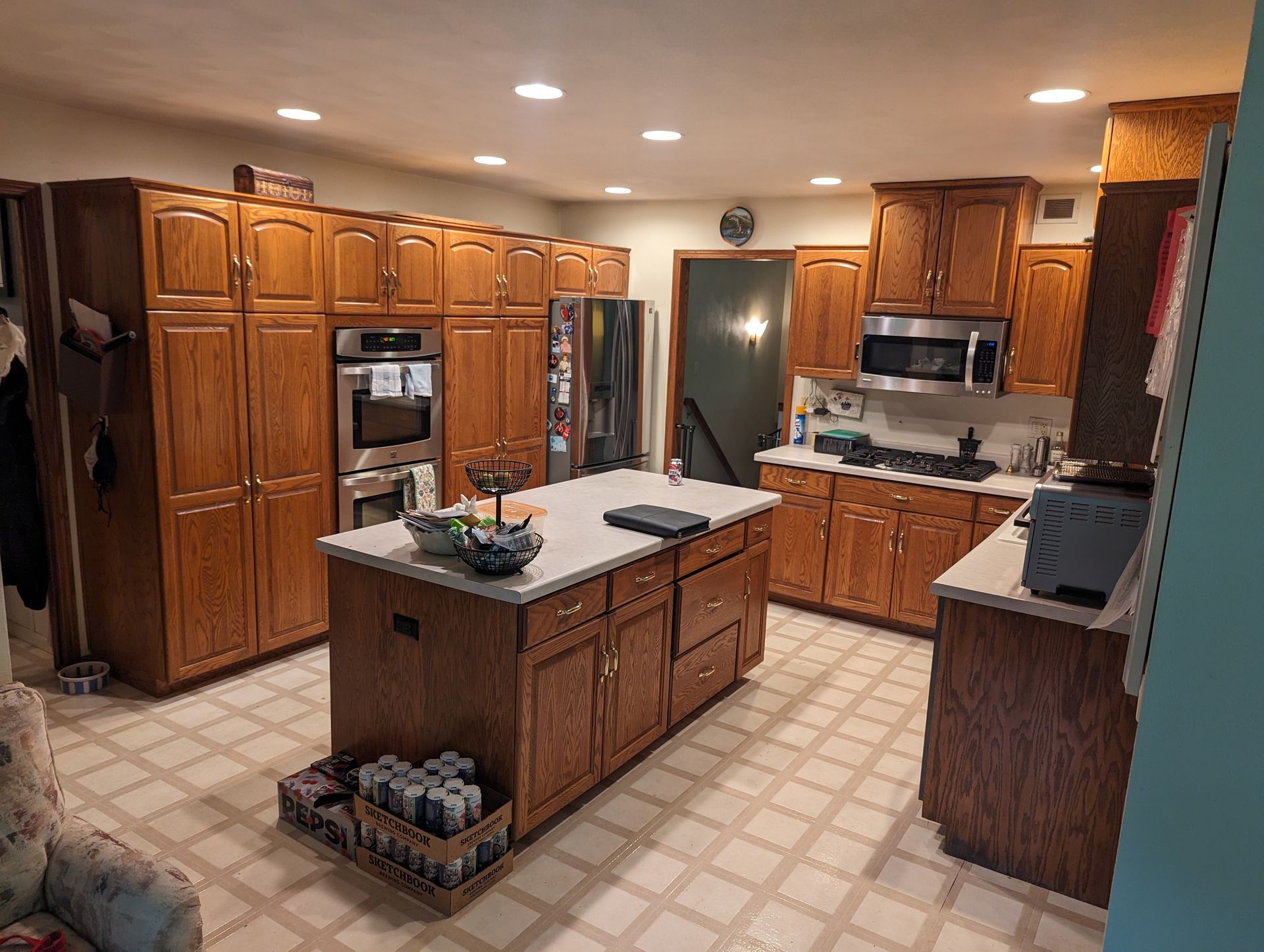 Older style kitchen, brown oak cabinets