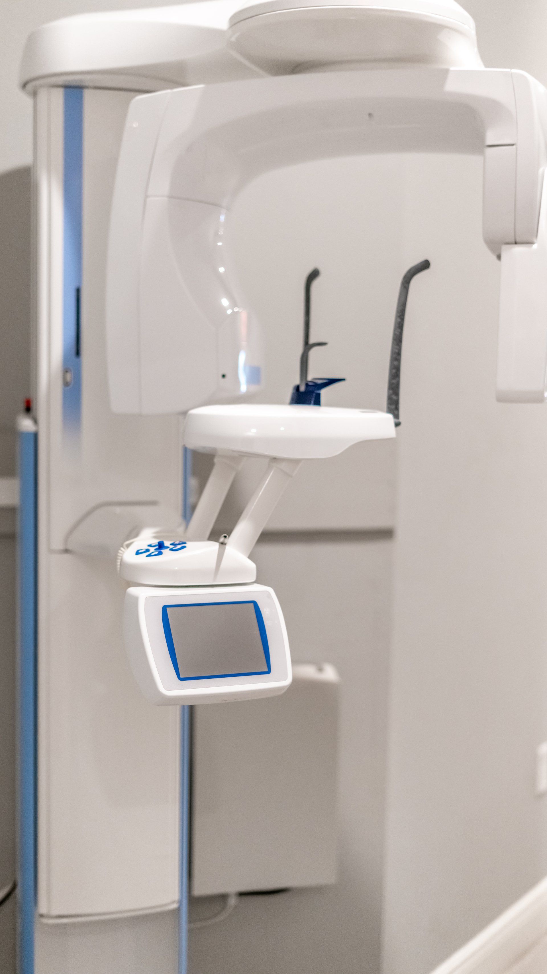 A dental x-ray machine is sitting in a dental office.