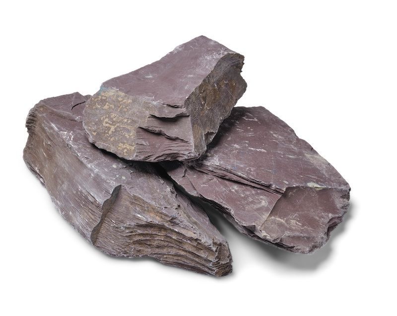 Pile of roughly-edged, reddish-purple shale rocks.