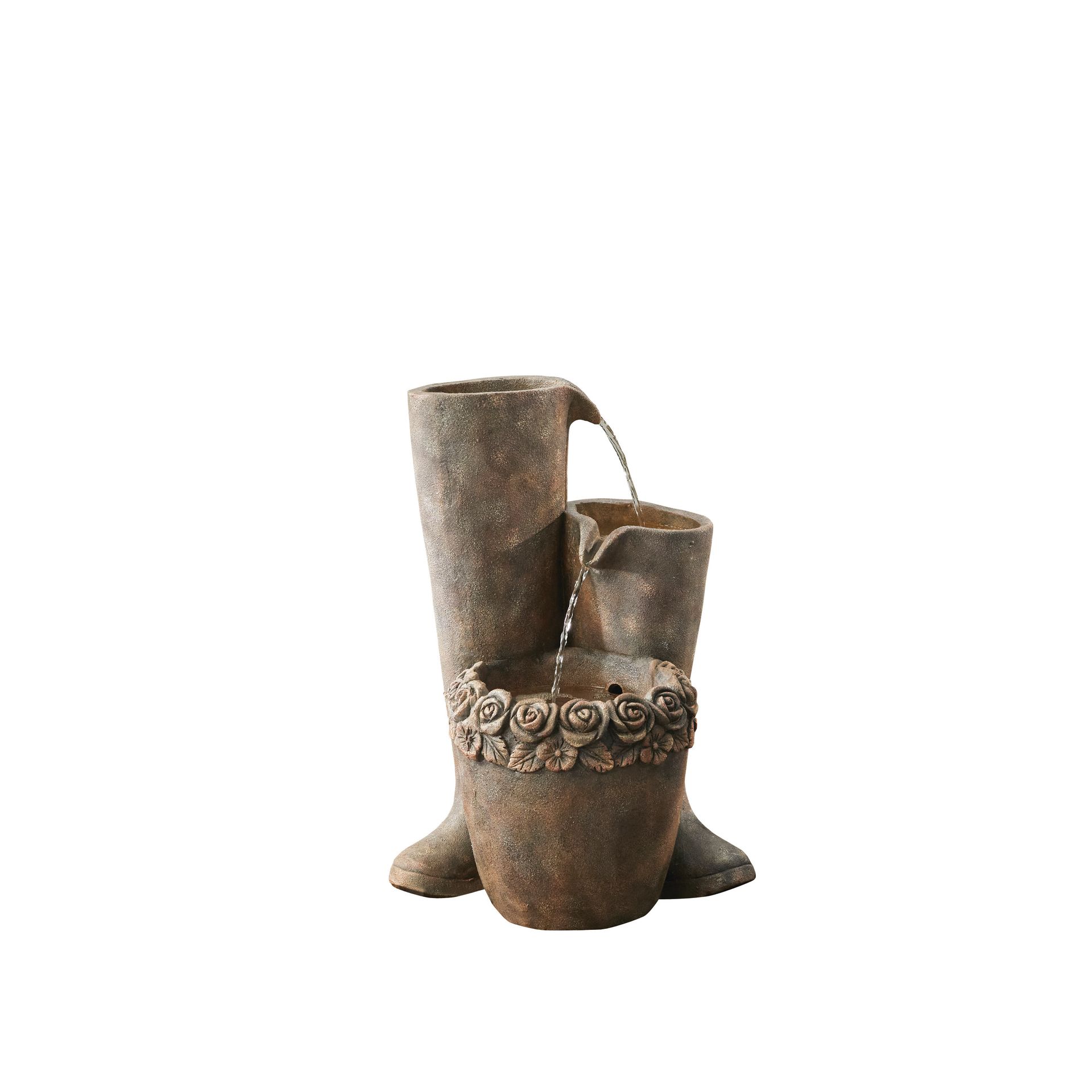 Garden fountain shaped like rain boots with water flowing.