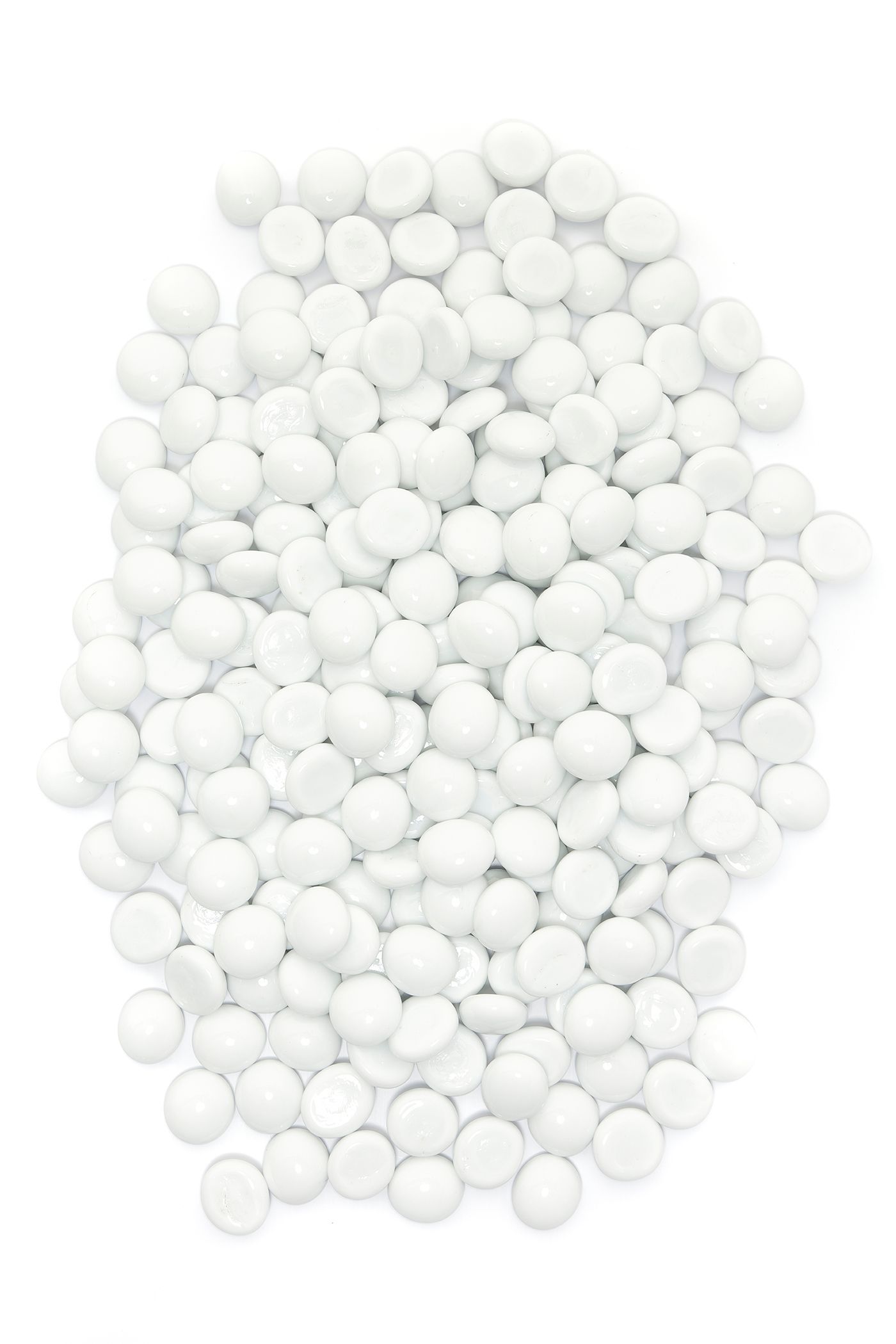 Pile of small, round, white candies.