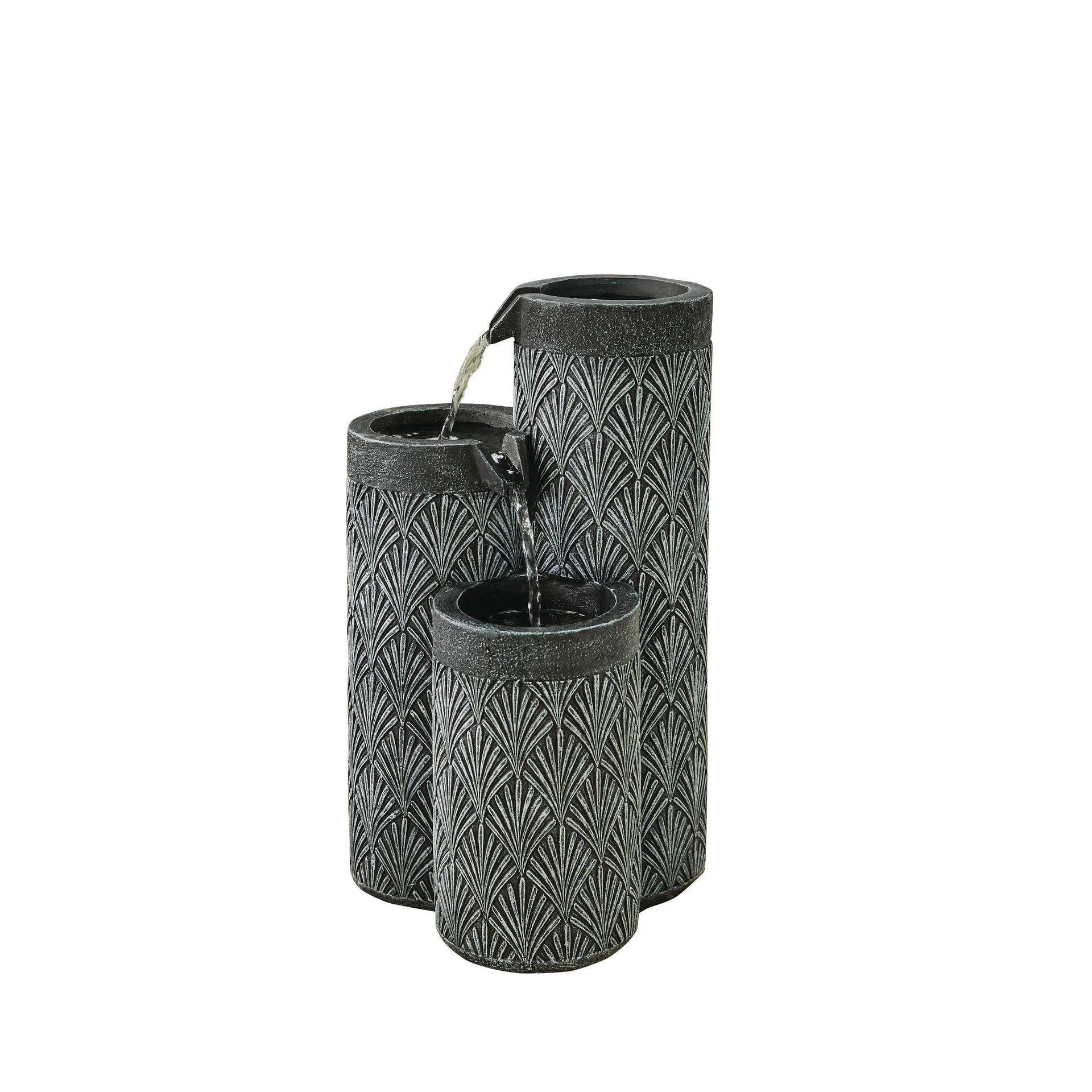 Three-tiered outdoor fountain with water cascading from top to bottom. Black and gray, cylindrical design.