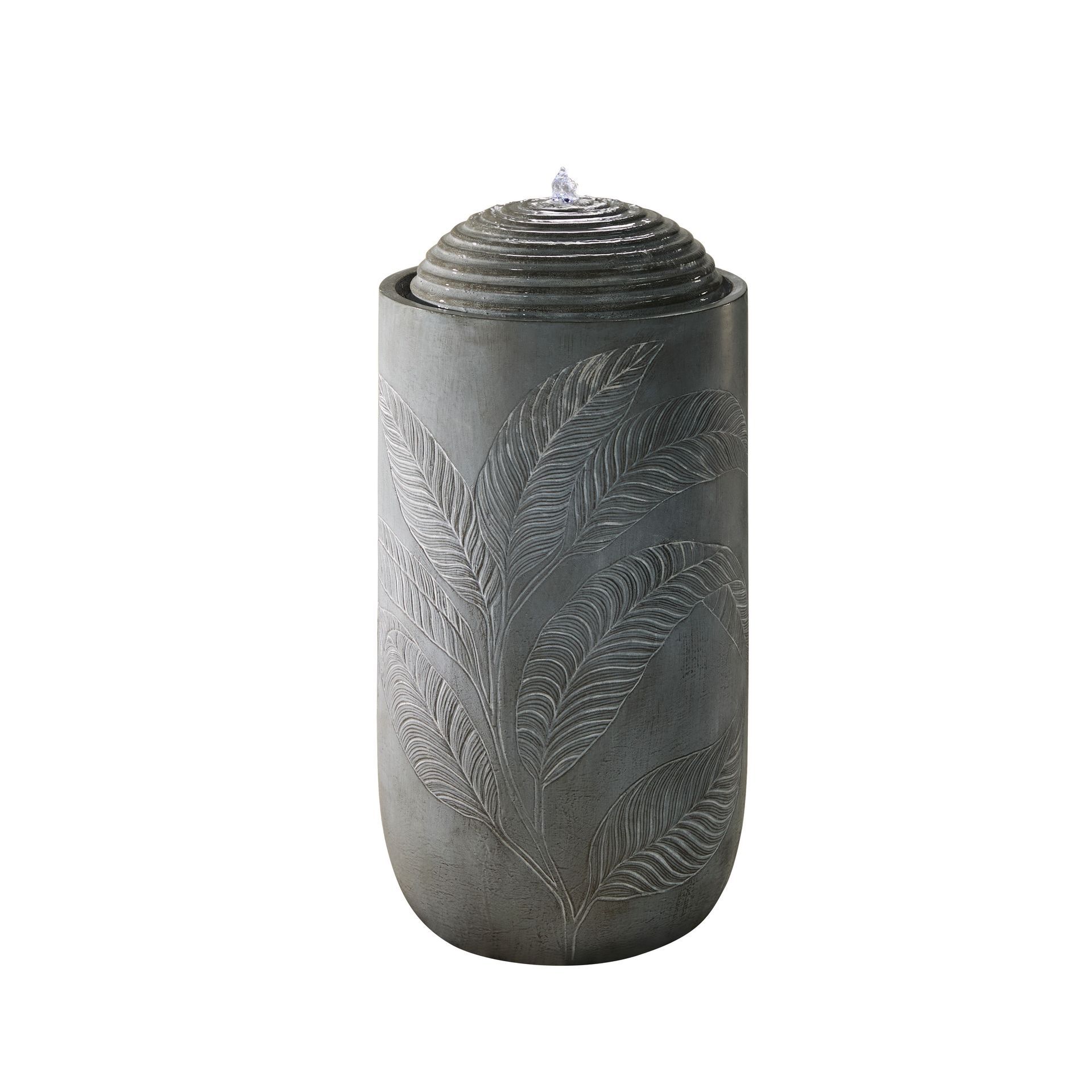 Gray outdoor fountain with water spouting from the top, engraved with a leaf pattern.