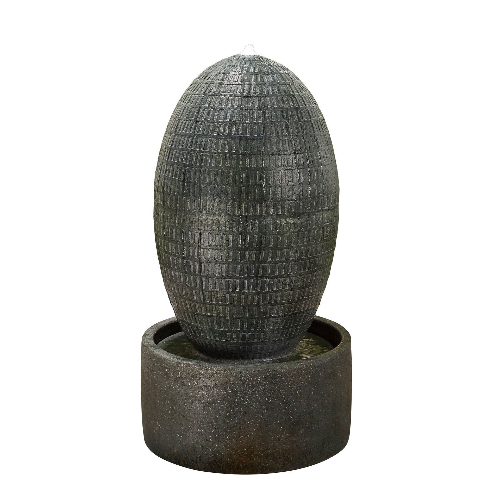 A decorative outdoor water fountain: an oval stone structure atop a round base. Water trickles down.
