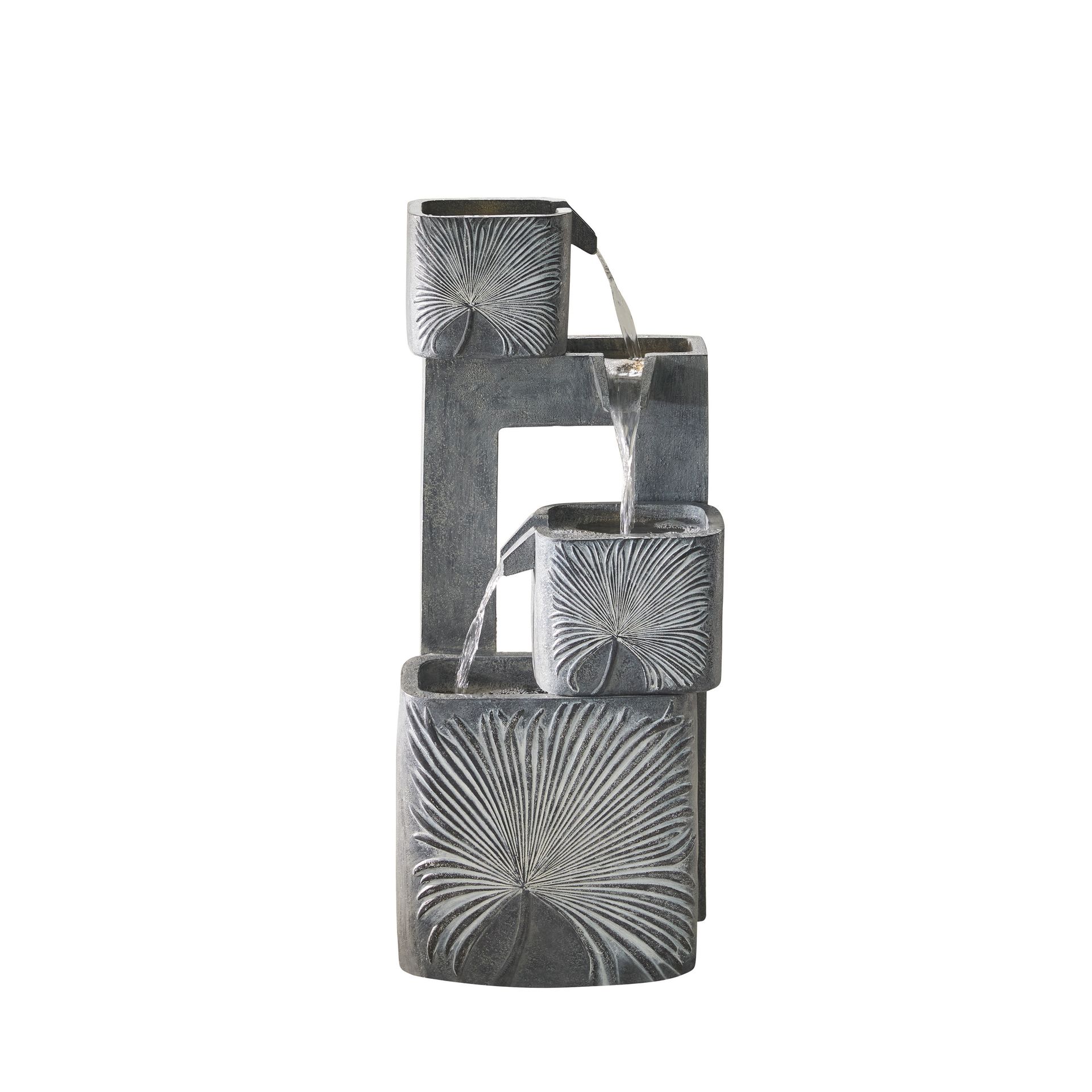 Stone outdoor water fountain with water cascading from square basins.