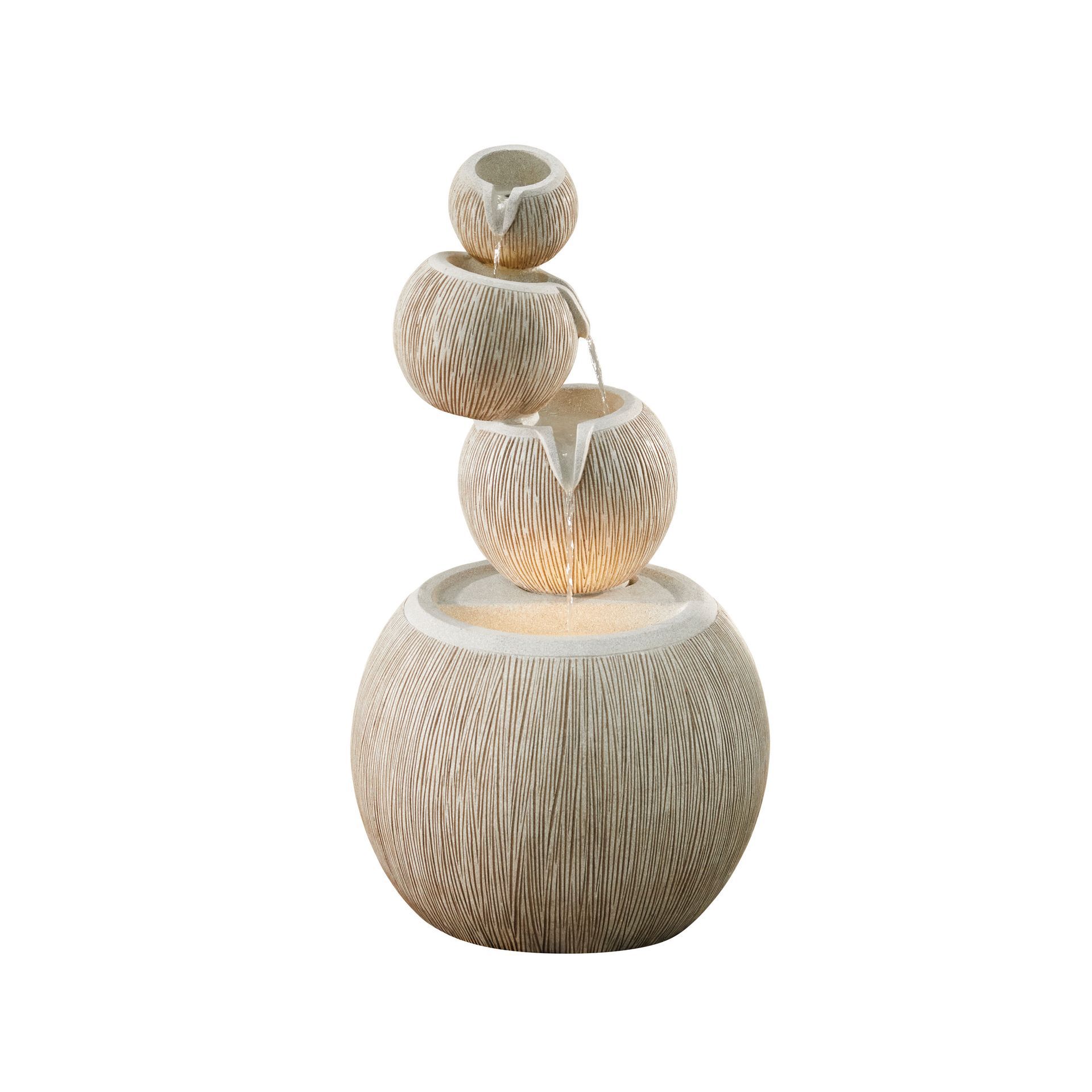 Indoor water fountain with stacked spherical bowls, water flowing, beige textured surface.