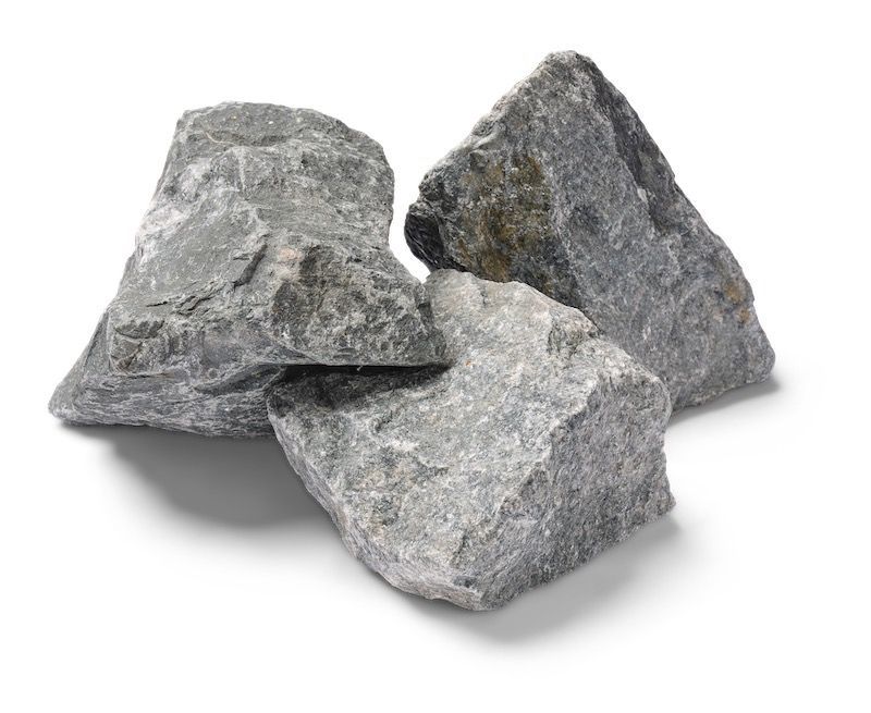 Three gray, rough-textured rocks piled together, casting shadows.