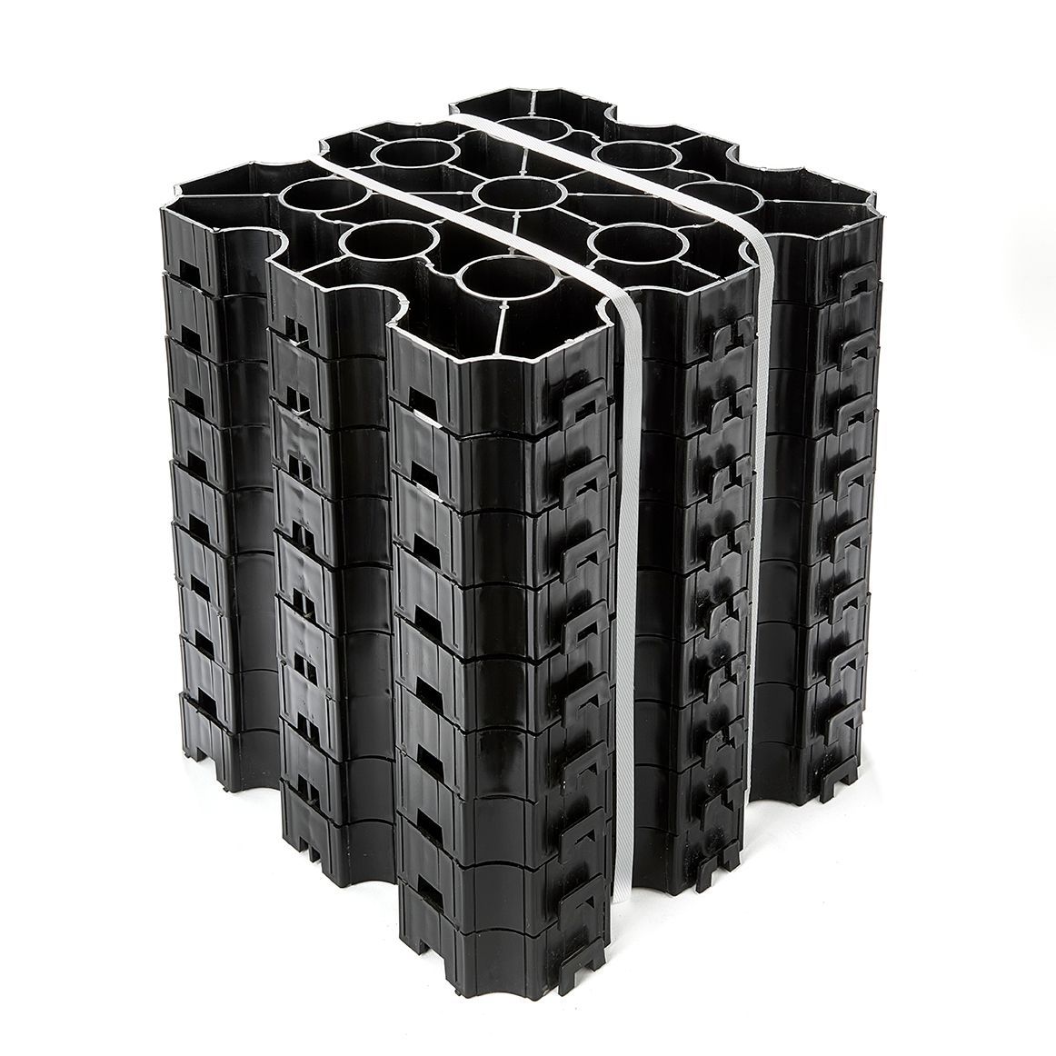 Black plastic modular structure, bundled with white straps, for underground water storage.