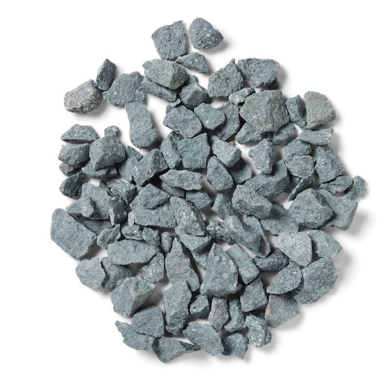 Pile of blue-gray gravel stones, irregularly shaped and scattered on a white background.