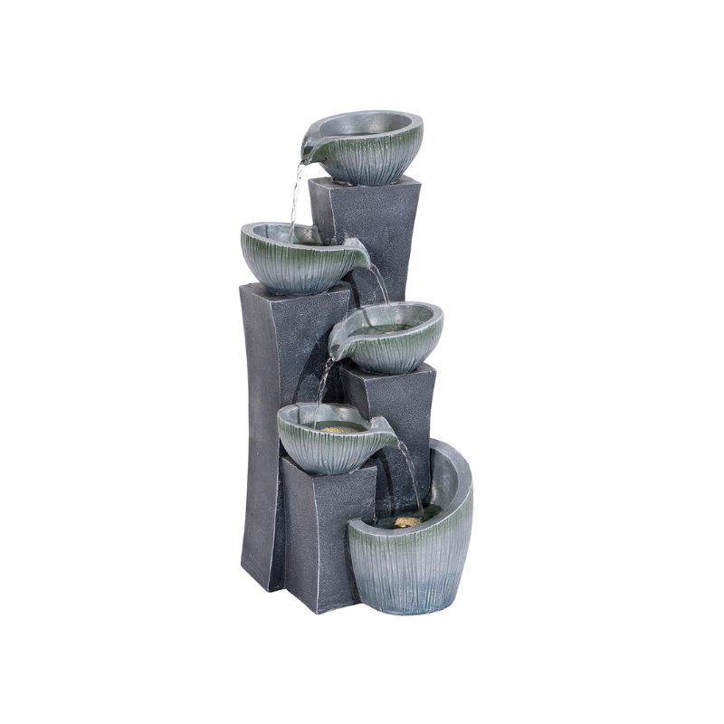 Water fountain with stacked bowls and grey stone structure. Water cascades down.