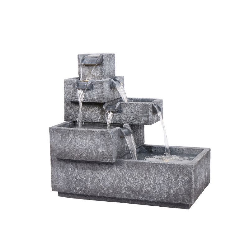 Gray tiered outdoor water fountain with flowing water.