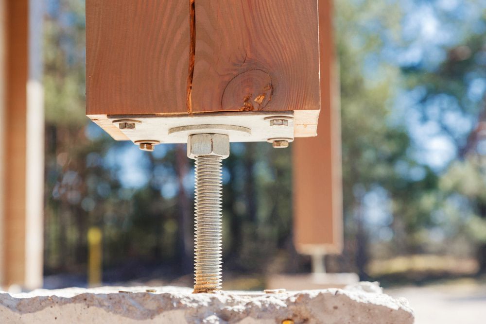 A Close Up Of A Wooden Post With A Screw And Nut Attached To It — Johnson's Timber Agencies In Ulladulla, NSW