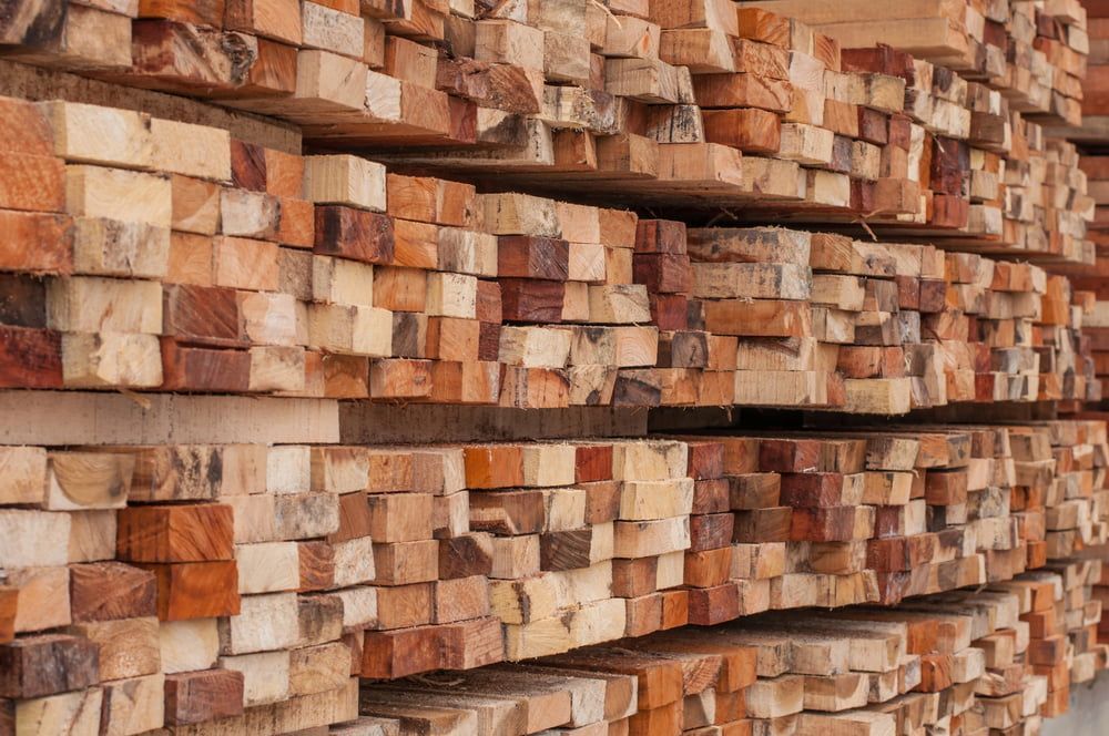 A Pile Of Wooden Blocks Stacked On Top Of Each Other — Johnson's Timber Agencies In Ulladulla, NSW