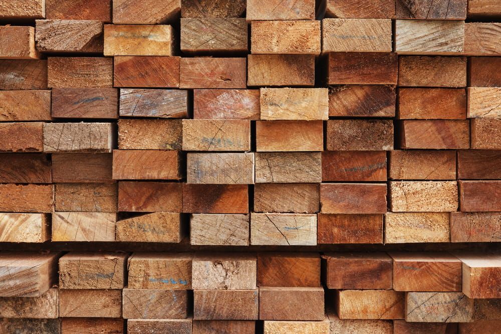A Pile Of Wooden Blocks Stacked On Top Of Each Other — Johnson's Timber Agencies In Ulladulla, NSW