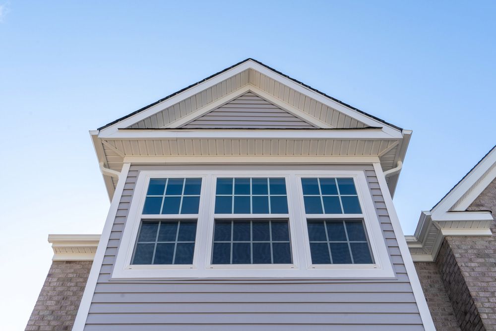 A House With A Lot Of Windows And A Blue Sky In The Background — Johnson's Timber Agencies In Ulladulla, NSW