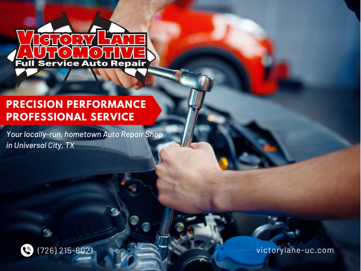 Mechanic working on car engine, Victory Lane Automotive ad. Red car in background. | Victory Lane Automotive