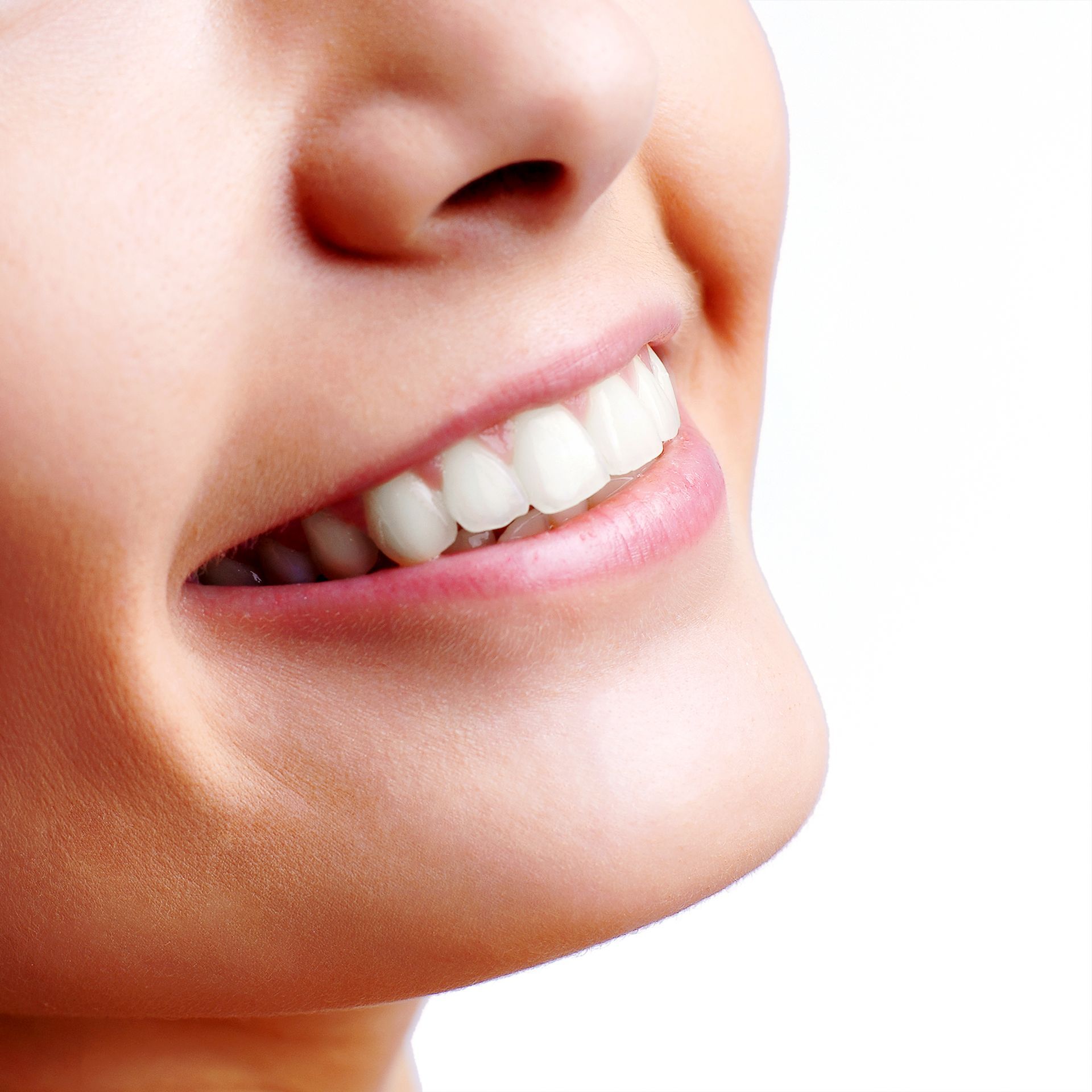 A woman smiling, showcasing the results of teeth whitening in Naples, NY at Dansville Family Dental Care.