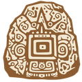 Stylized brown Aztec-like stone carving with geometric patterns and a central face motif