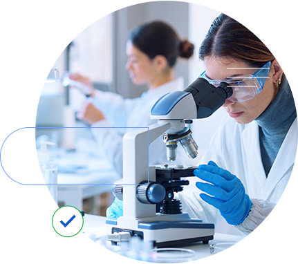 a scientist looking on a microscope