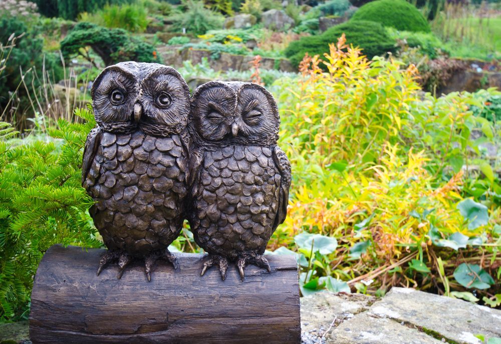 Two owl statue in garden — Craig’s Lawn Mowing and Garden Maintenance in Menai, NSW
