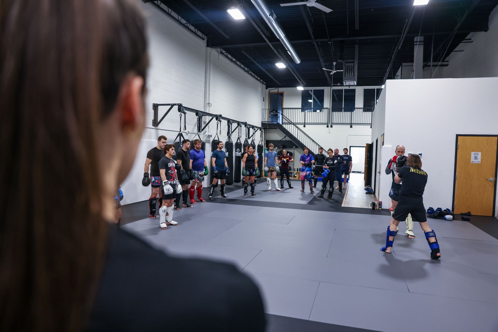 Adults drilling Brazilian Jiu-Jitsu techniques at The Academy Eden Prairie in Minneapolis, MN.