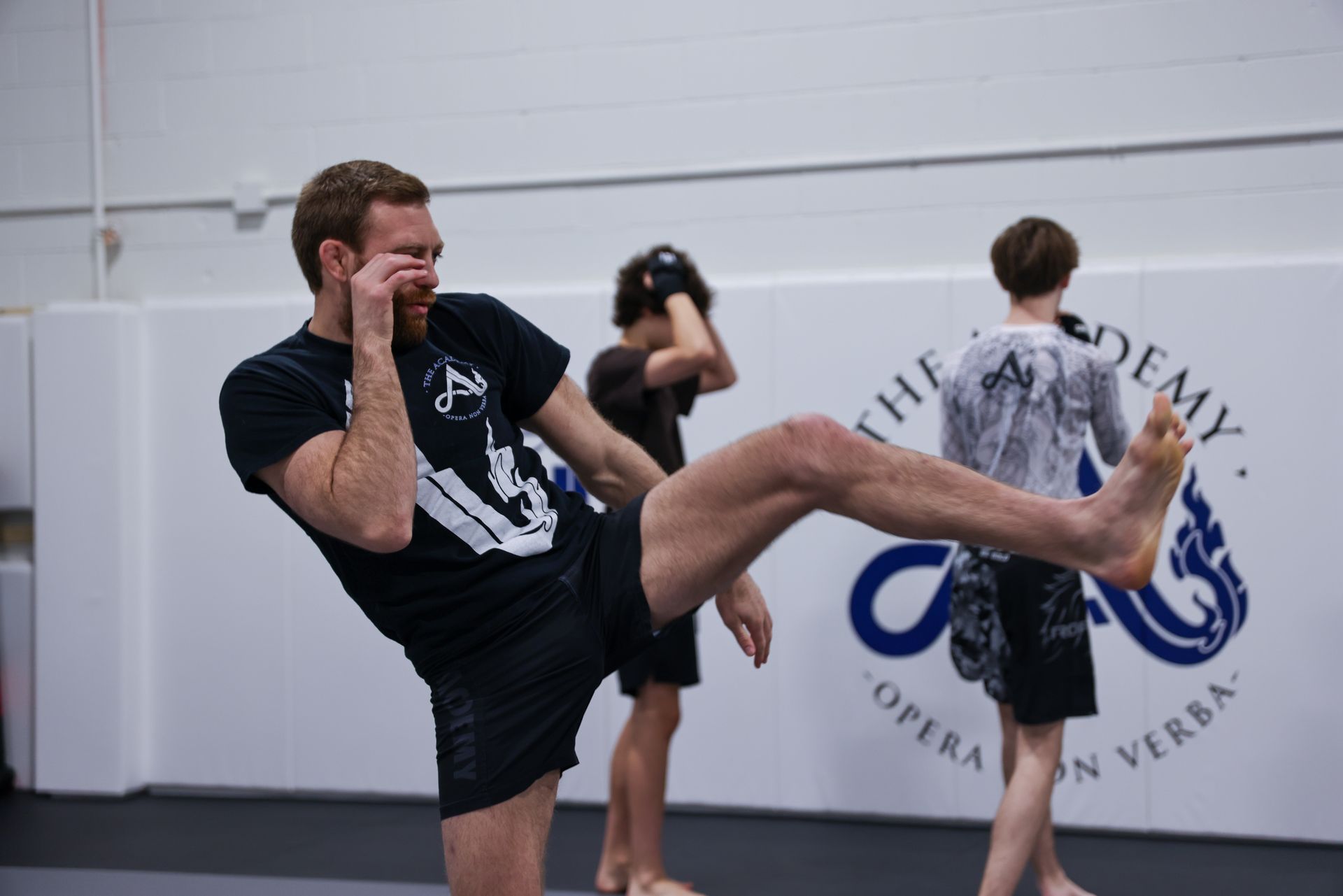 Adults drilling Brazilian Jiu-Jitsu techniques at The Academy Eden Prairie near Minneapolis, MN.