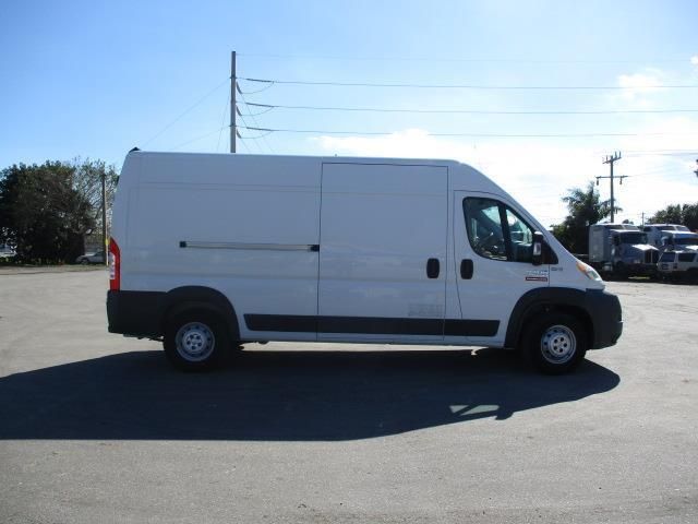 A white van is parked in a parking lot