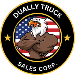 A logo for dually truck sales corp. with a bald eagle