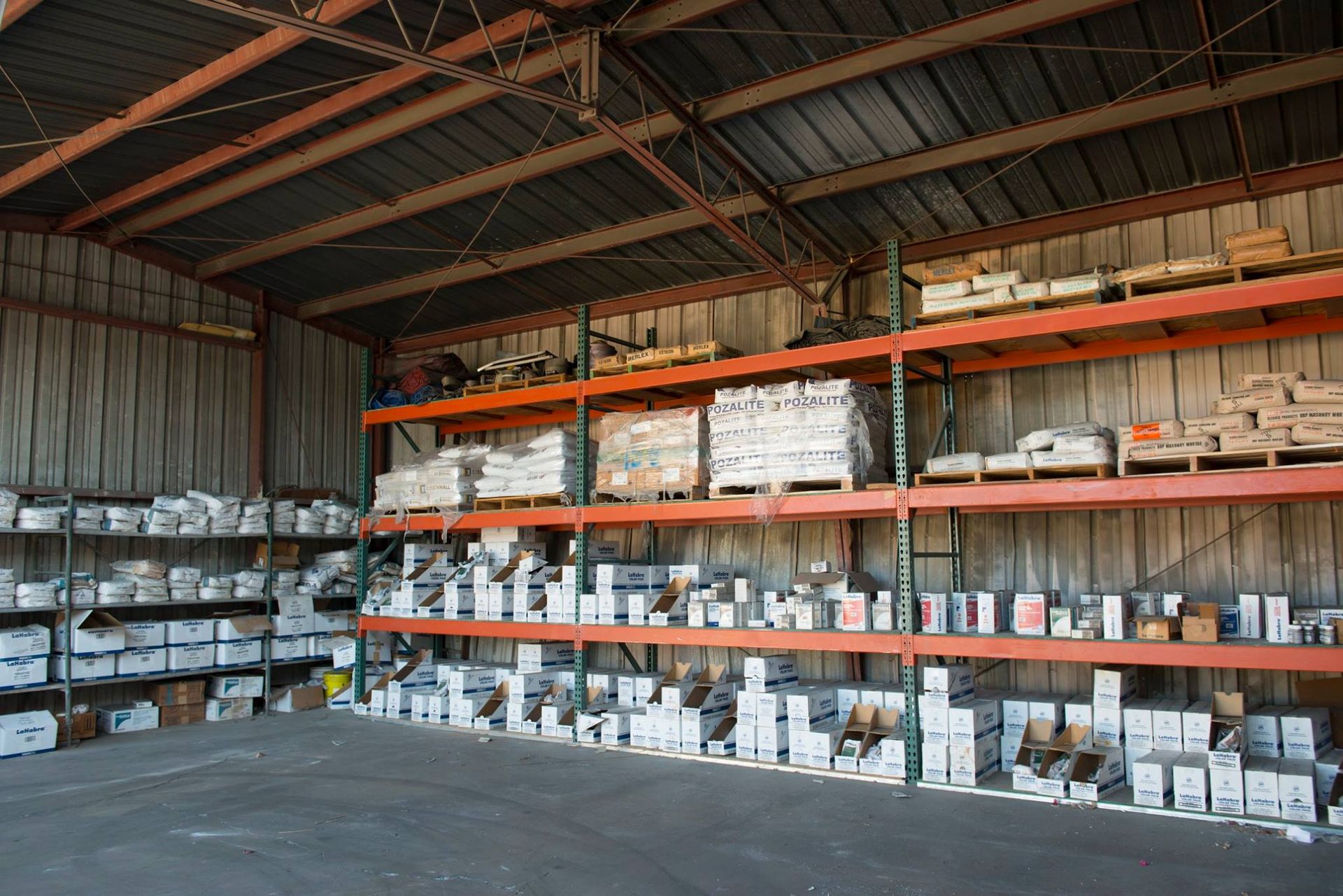 A warehouse filled with shelves filled with lots of items.