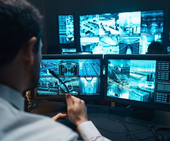 Security Guard Watching Video Monitoring Surveillance Security System — Geelong, VIC — John Scarlett Security Pty Ltd Security Guard Watching Video Monitoring Surveillance Security System — Geelong, VIC — John Scarlett Security Pty Ltd