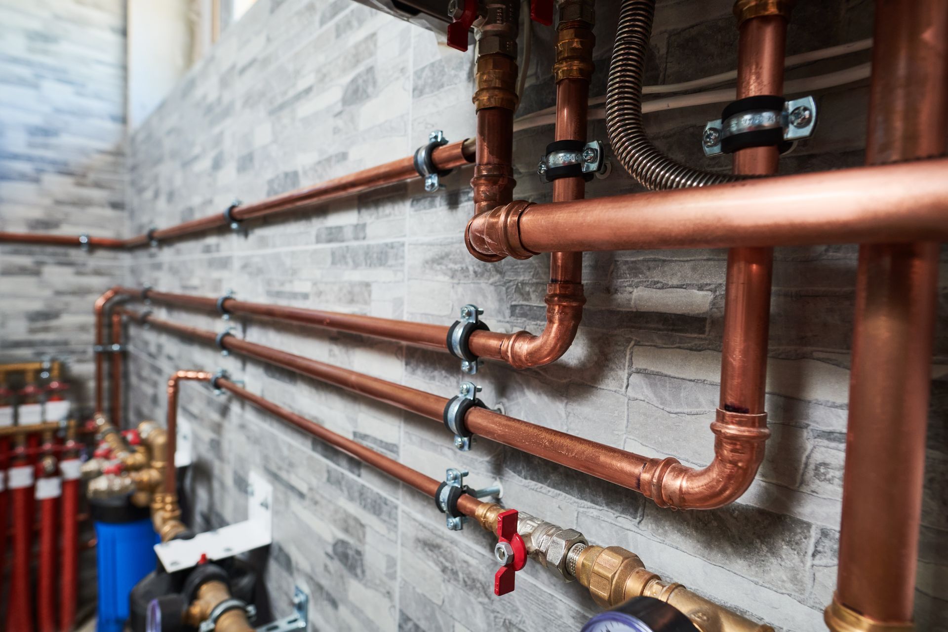 Male Plumber Repairing Sink In Bathroom
