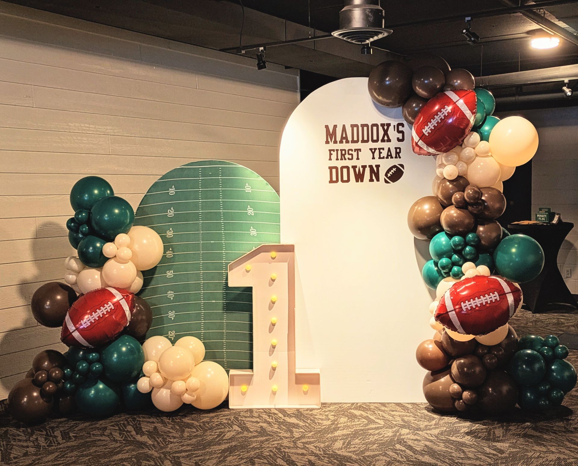 1st birthday number marquee and balloons
