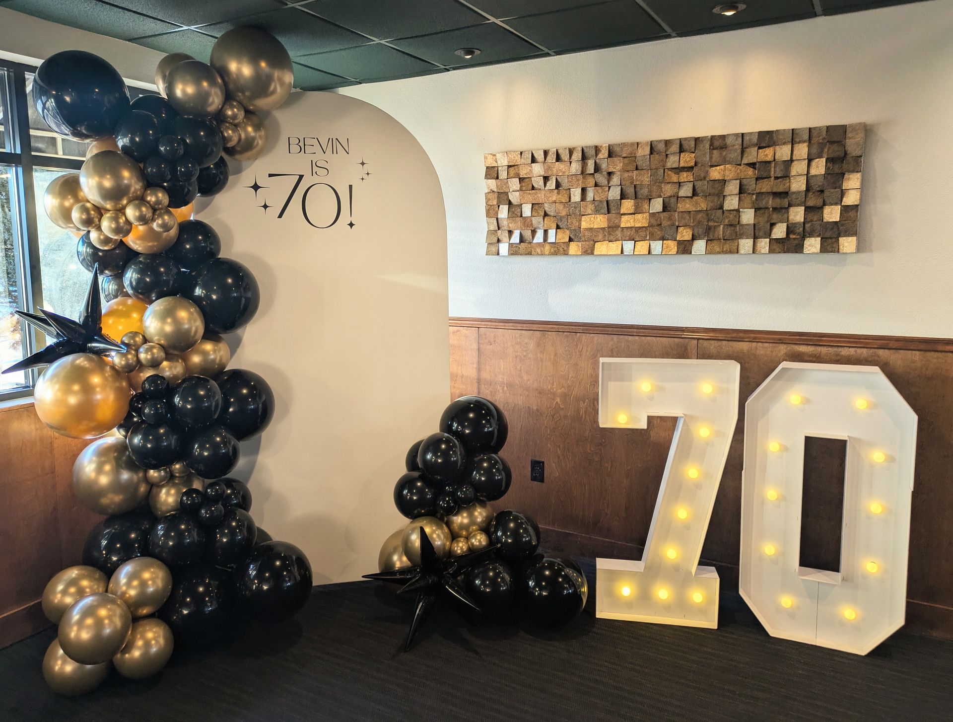 70th birthday number marquee and balloons