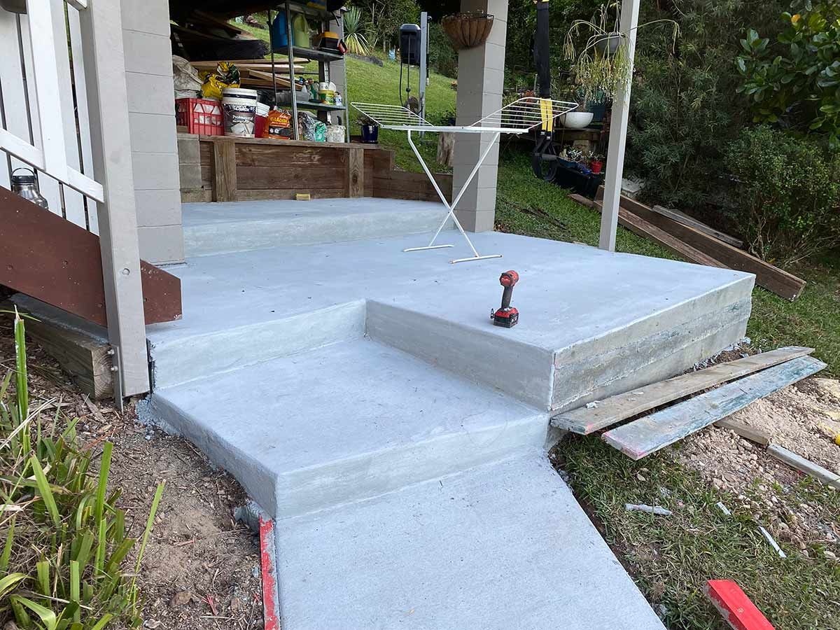 A Concrete Walkway Is Being Built in Front of A House — Shaka Concreting In Byron Bay, NSW