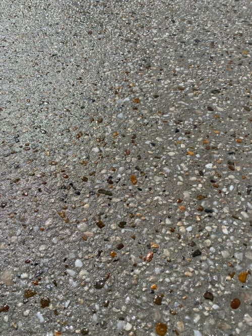 A close up of a exposed aggregate concrete — Shaka Concreting In South Golden Beach, NSW