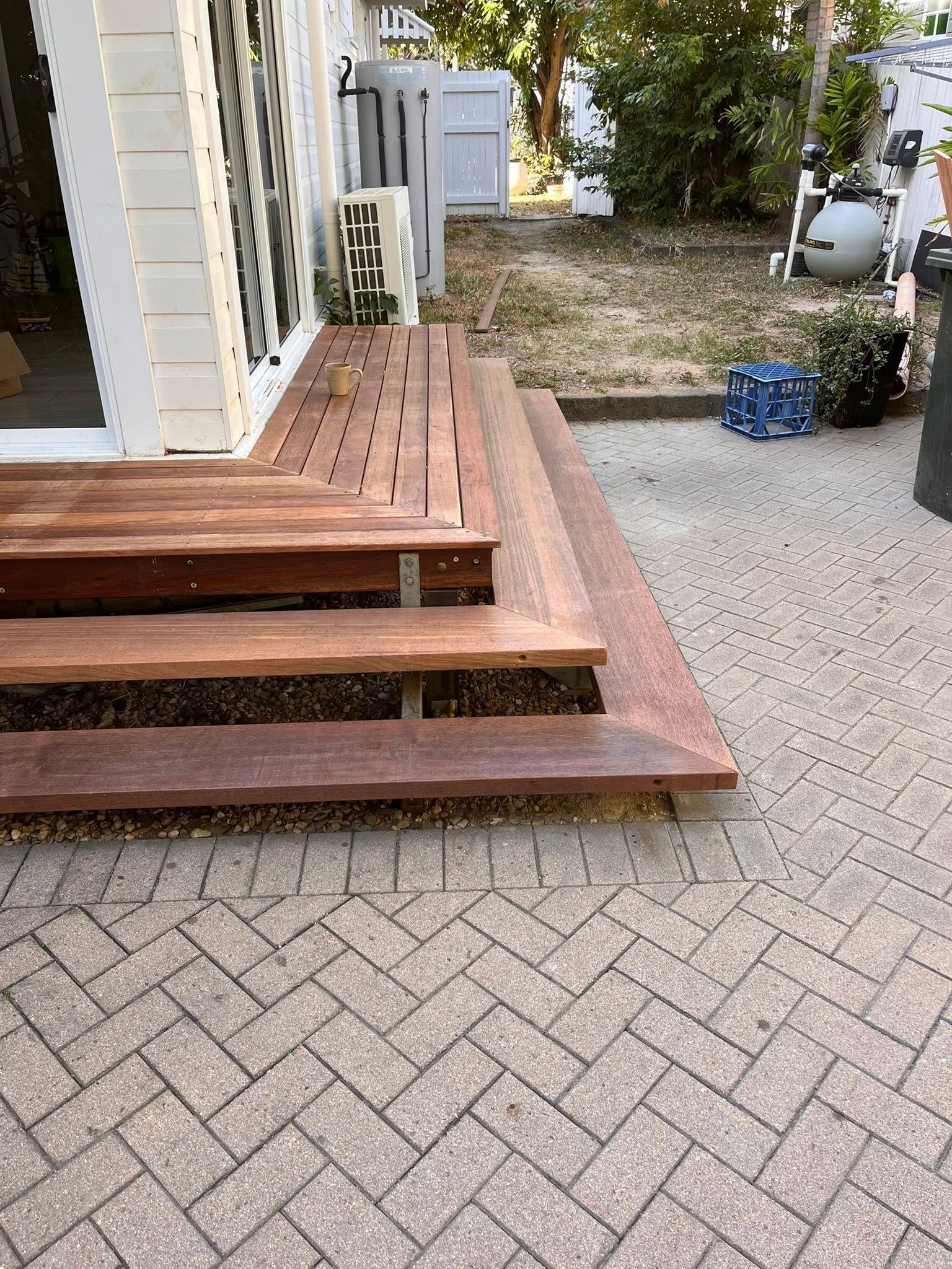 Wooden Front Steps Beside a House, Leading to A Paved Driveway — SS Building Services in Townsville, QLD