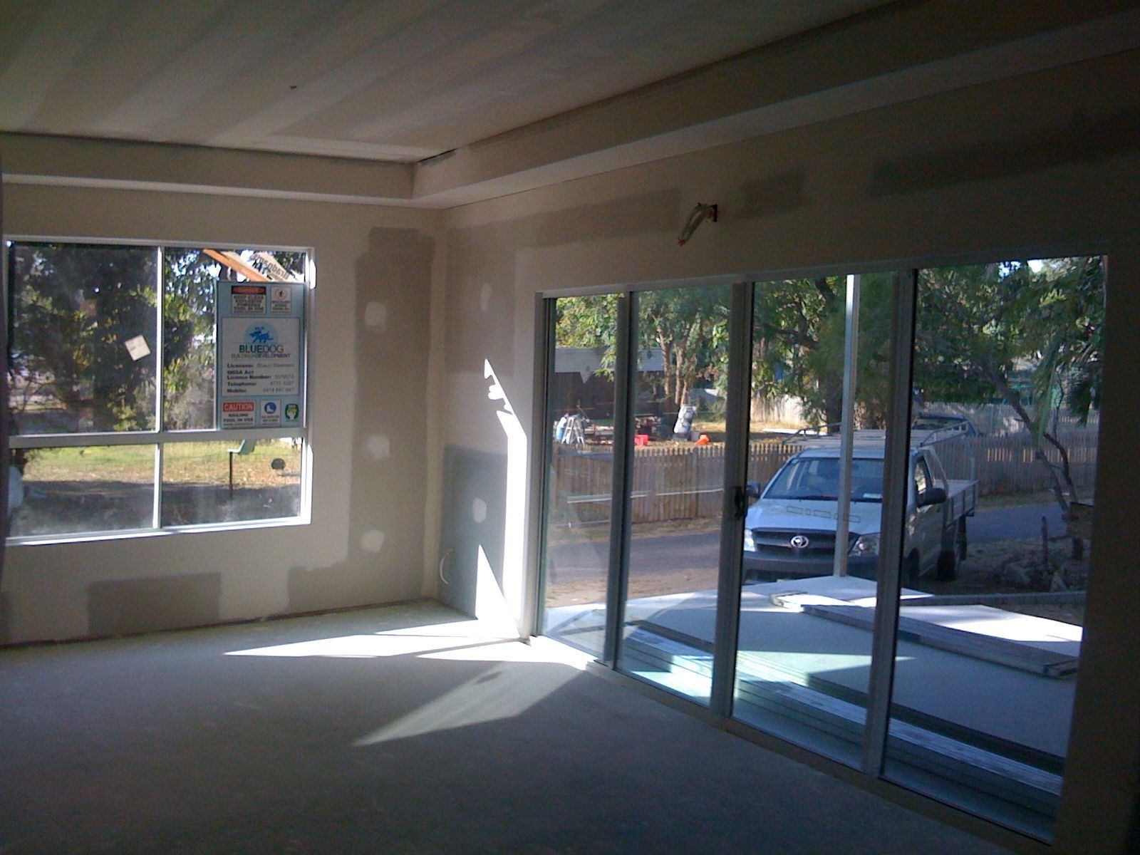 Empty Room with Large Windows and Glass Doors  — SS Building Services in Townsville, QLD