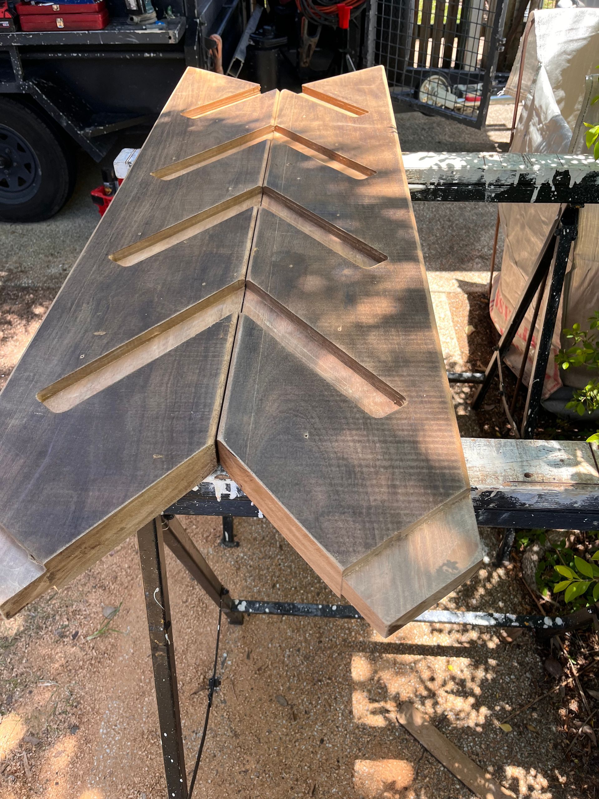 Rusty Metal Roof Structure with A Chevron Pattern on A Construction Site — SS Building Services in Townsville, QLD