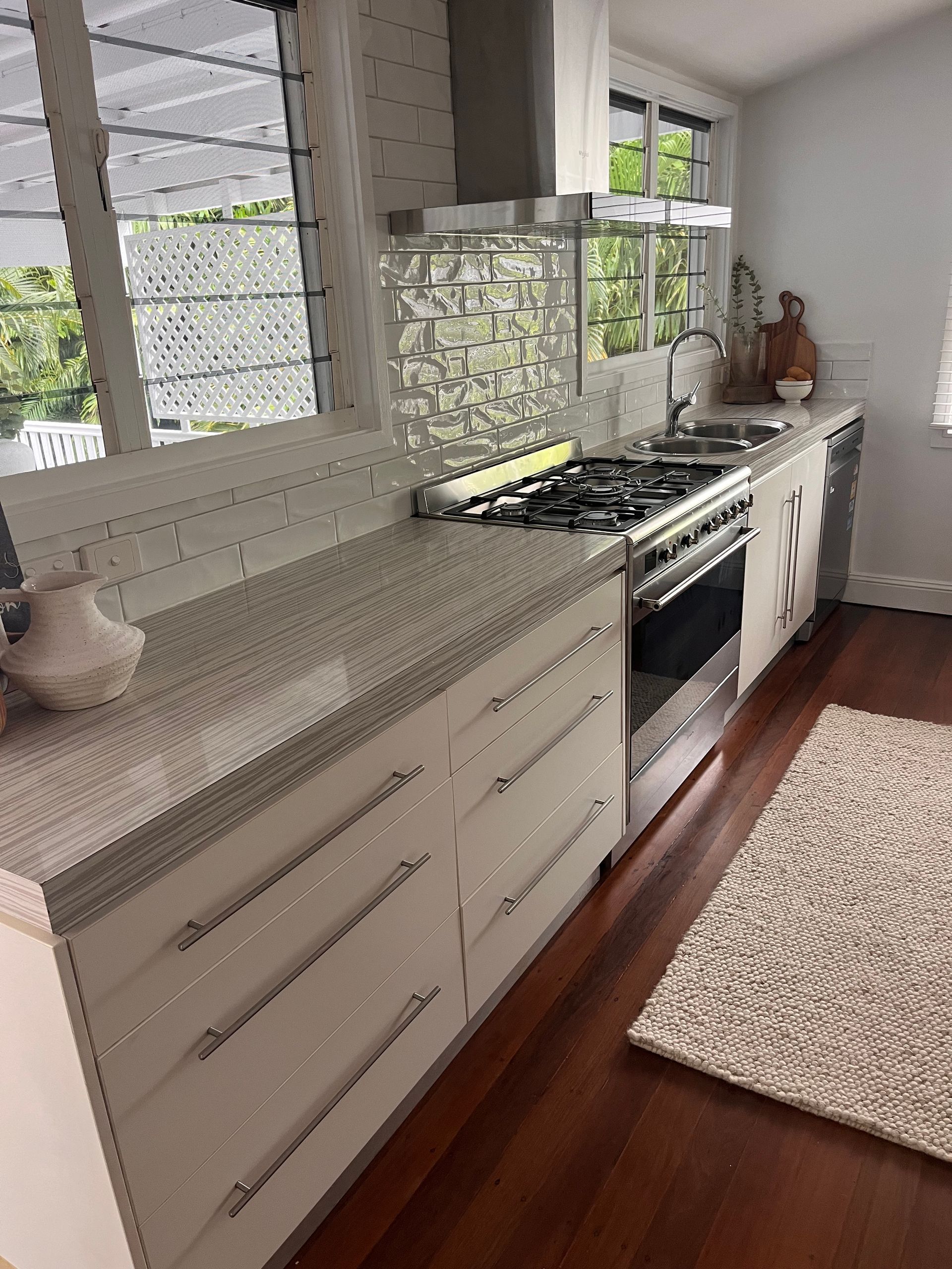 Bright Modern Kitchen with White Cabinets — SS Building Services in Townsville, QLD