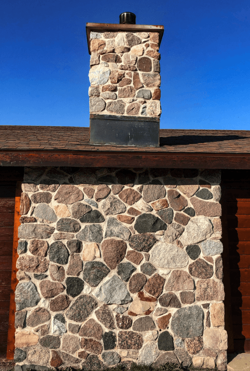 Colorful Stone chimney on house
