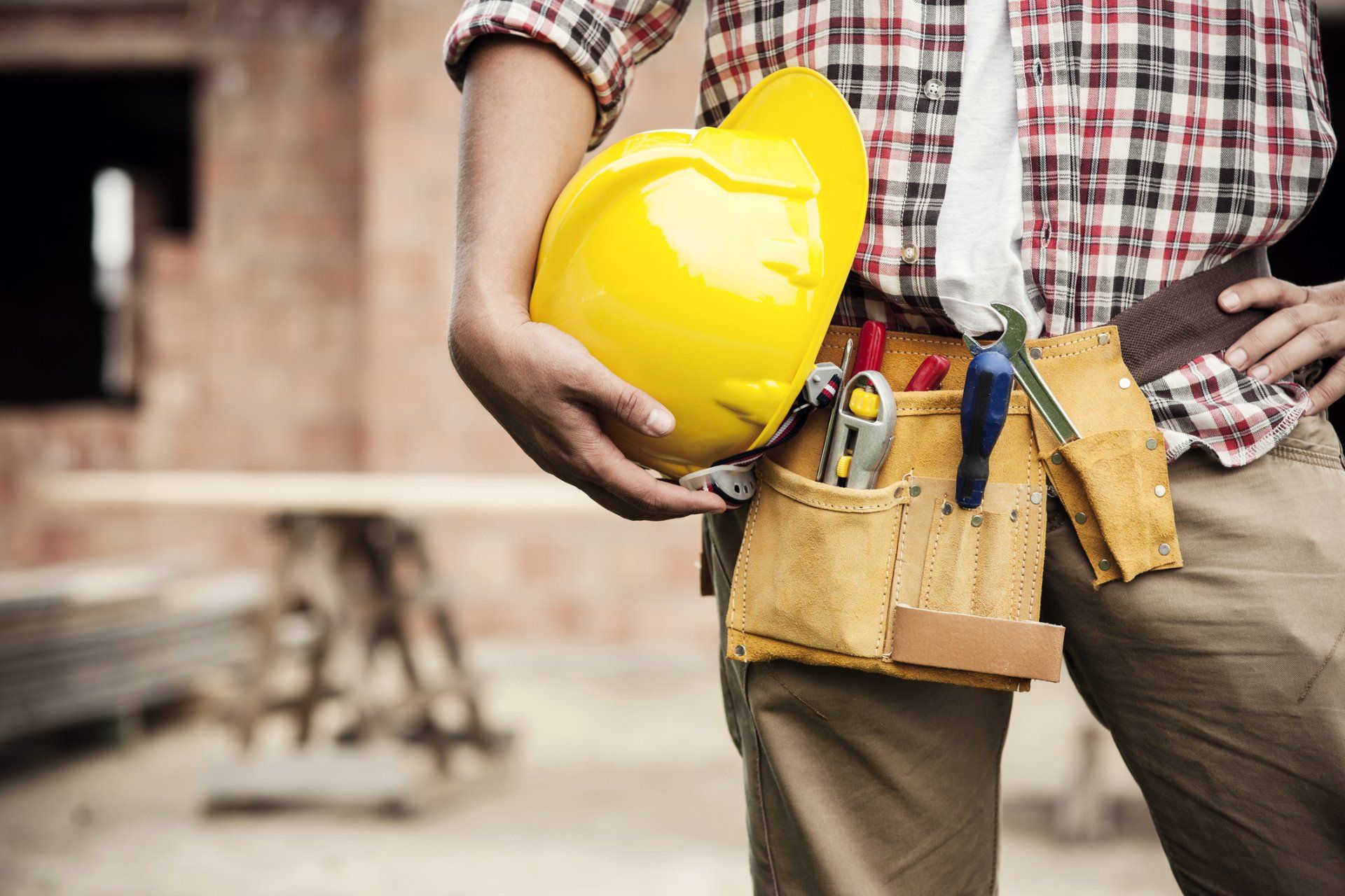 Repairman Holding Safety Helmet | Peculiar, MO | Ron Construction LLC