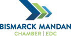 Bismarck Mandan Chamber EDC logo with blue and green chevrons and text on white background