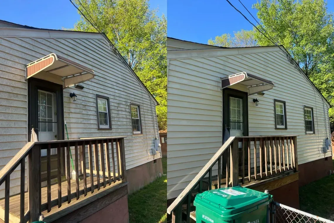 Side-by-side view of a house exterior with a small wooden porch, awning, and green bins below.