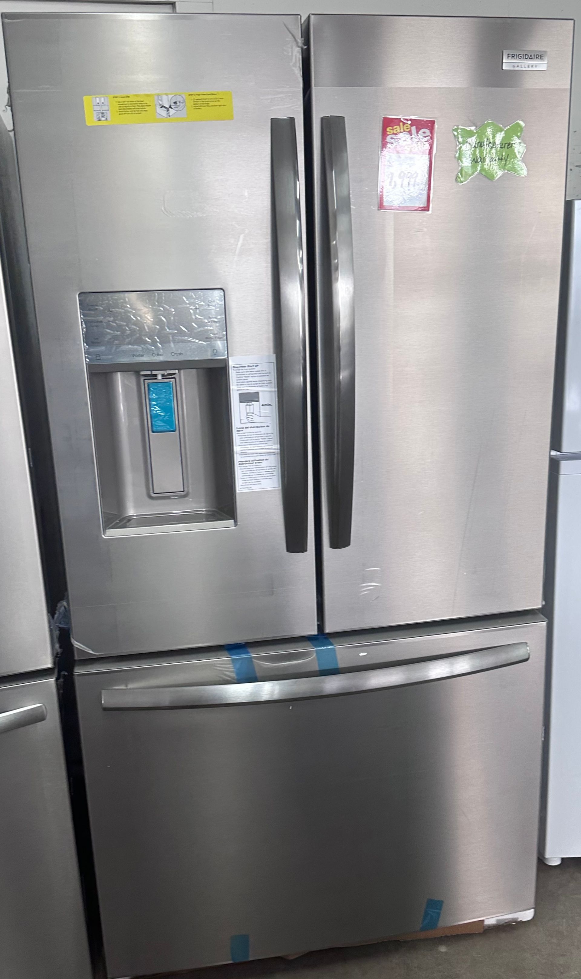 Stainless steel French-door refrigerator with water dispenser and freezer drawer