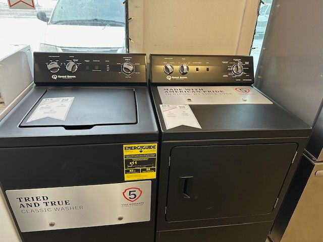 A black washer and dryer that says tried and true
