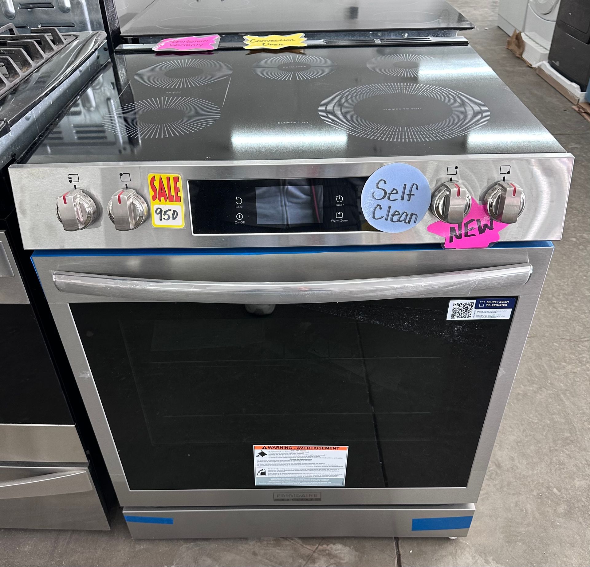 Stainless steel electric range with black cooktop and oven door; marked 