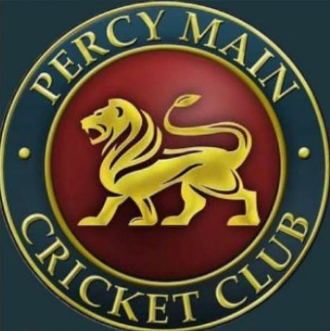 Percy Main Cricket Club crest with gold lion on a red circle and navy border