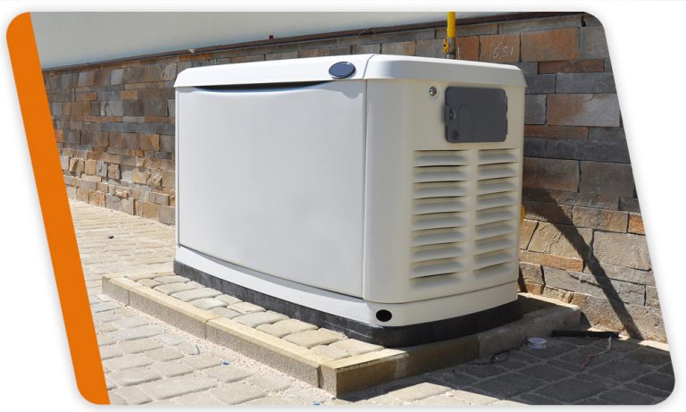 White outdoor generator on a wooden platform beside a brick wall